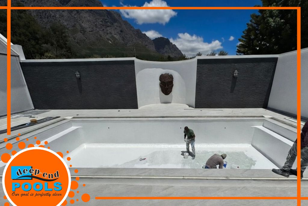 Deep-End-Pools-luxury-fibreglass-pool-construction-paarl-deep-end-pools-franschhoek-cape-winelands Workers applying fibreglass lining to a large luxury pool in Franschhoek – durable, crystal-clear finish by Deep End Pools. Deep End Pools services Franschhoek & Paarl, Cape Winelands, South Africa.