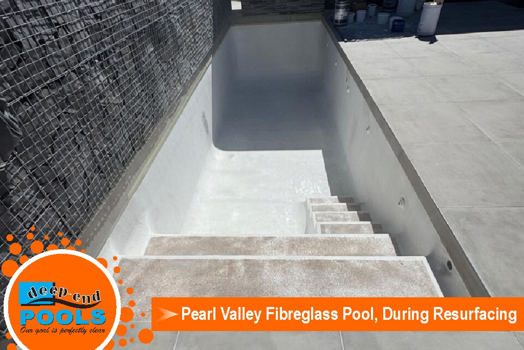 deepend-pools-pearl-valley-fibreglass-pool-during-premium-rResurfacing-empty-pool-view Empty fibreglass swimming pool during professional resurfacing and topcoat application at Pearl Valley by Deep-End Pools